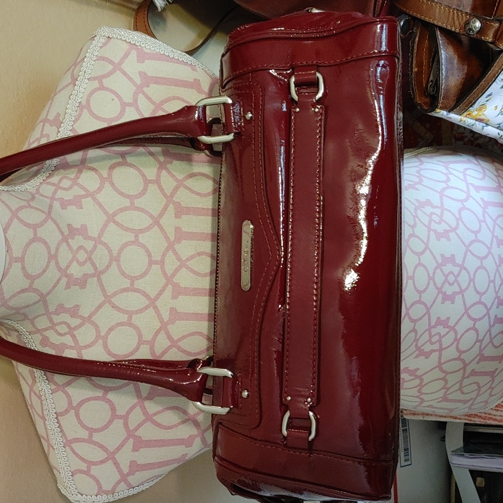 Burgundy patent leather barrel bag